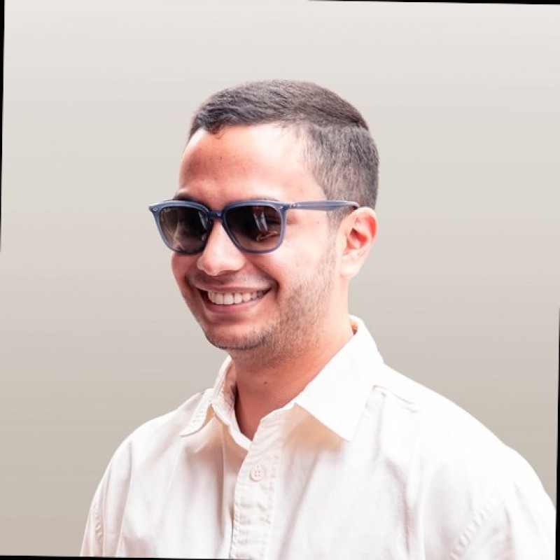 Gianfranco Gasbarri, smiling in sunglasses and a white shirt